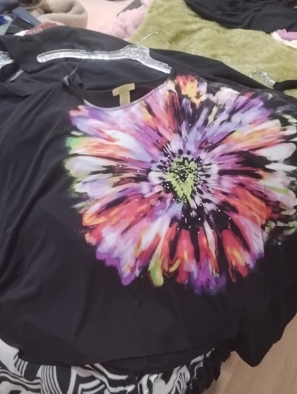Valerie Stevens Black Short Sleeve Top with Vibrant Floral Burst.